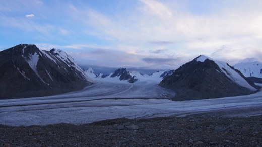 The Potanin Glacier between dark peaks, seen from the Tavan Bogd base camp area